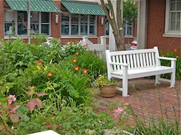 Sit at the bench in the garden